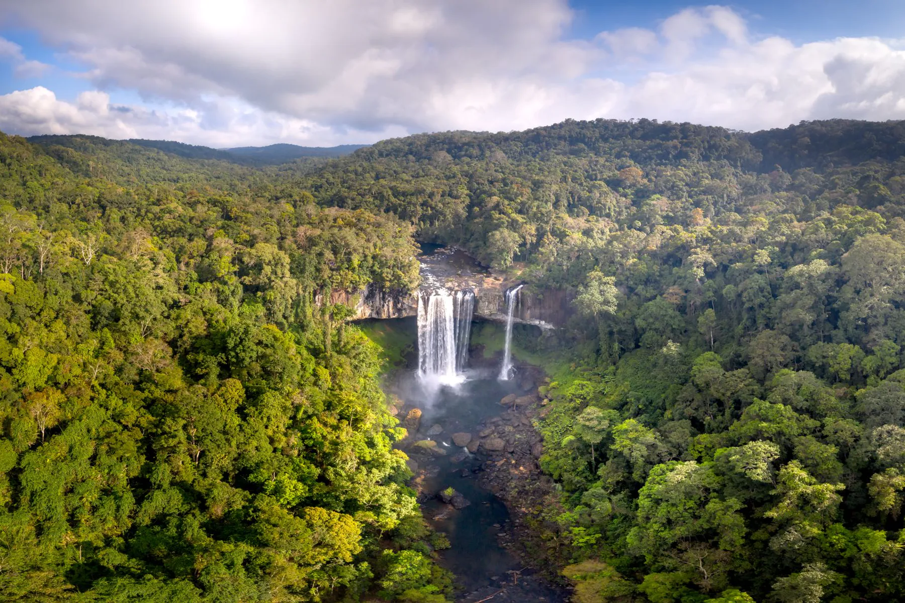 Aerial view of Tad Fane waterfall in the forest of the Bolaven Plateau