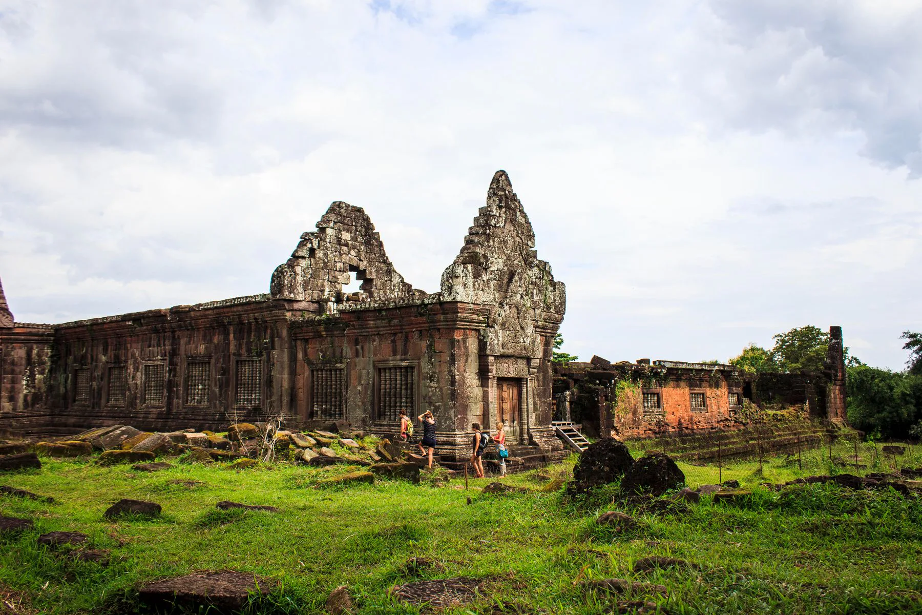 Ancient stone sanctuary and green grounds at Vat Phou in Champasak