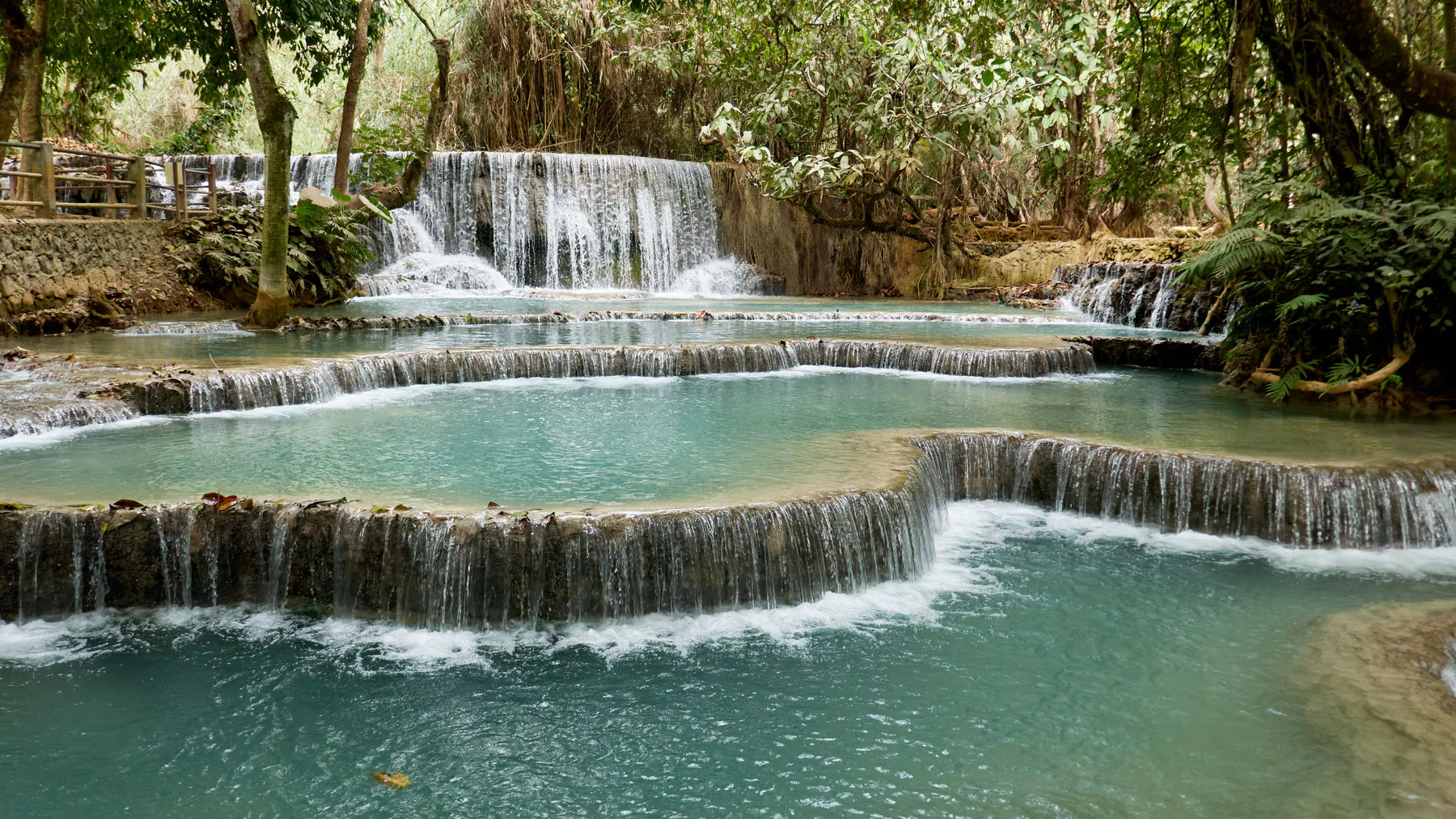 Turquoise tiered pools of Kuang Si Falls near Luang Prabang