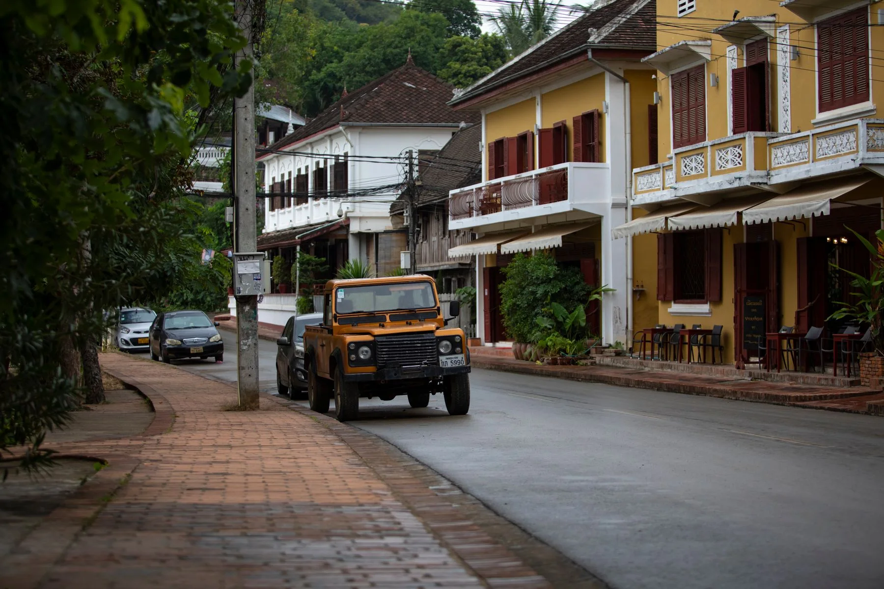 Historic guesthouses along a quiet street in Luang Prabang